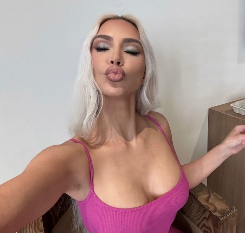 Kim Kardashian poses for a selfies after working out and doing Kim Kardashian's daily ab workout.
