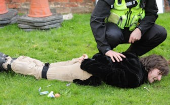 YORK, ENGLAND - NOVEMBER 09: A member of the public is arrested by Police after throwing eggs at Kin...