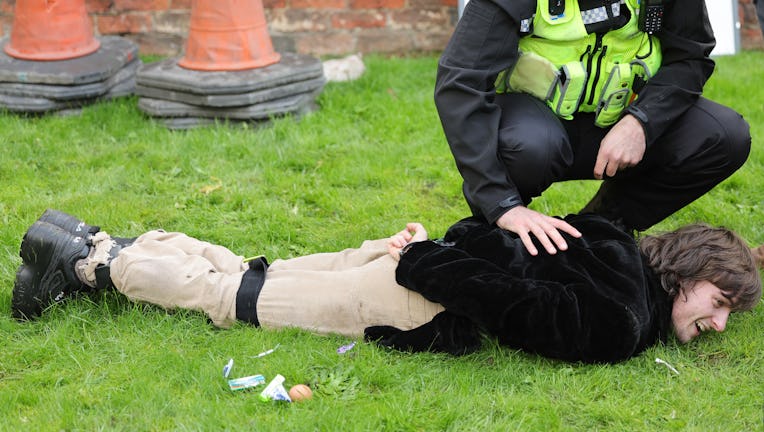 YORK, ENGLAND - NOVEMBER 09: A member of the public is arrested by Police after throwing eggs at Kin...