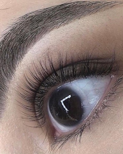 Up close image of a woman's eye after lash lift 