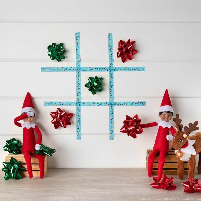 For a lazy Elf on the Shelf idea, create a game of tic-tac-toe on the wall with tape and bows.