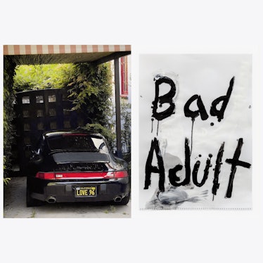 a photograph of a porsche with the words bad adult painted on a piece of paper next to it