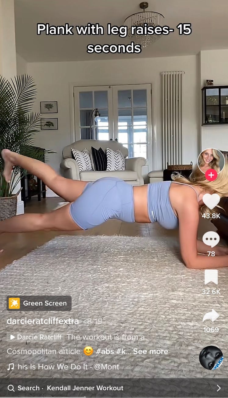 A TikToker shows leg raises as part of Kendall Jenner's 11-minute ab workout on TikTok. 