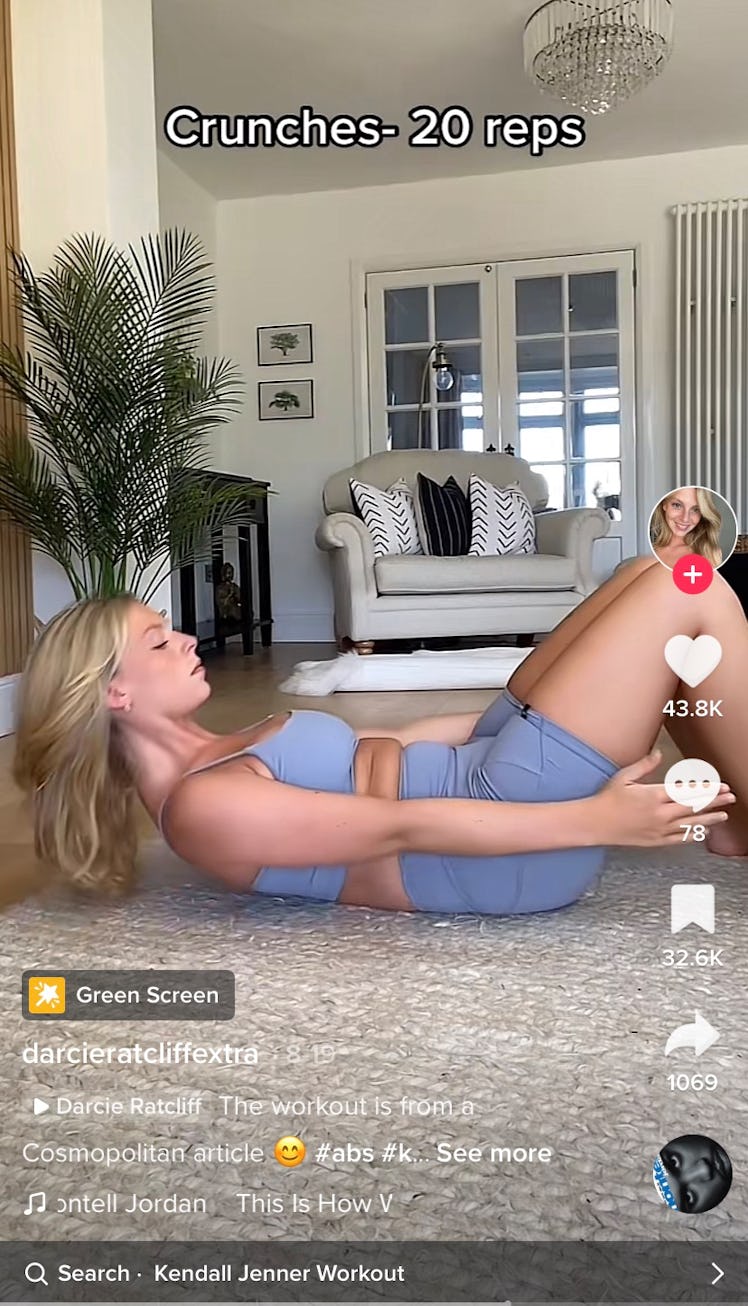 A TikToker does crunches as part of Kendall Jenner's 11-minute ab workout on TikTok. 