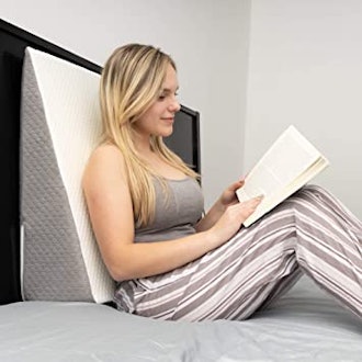If you're looking for pillows for watching TV in bed, consider this wedge pillow with memory foam.