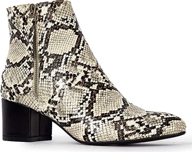 a pair of snakeskin ankle booties with a contrasting block heel