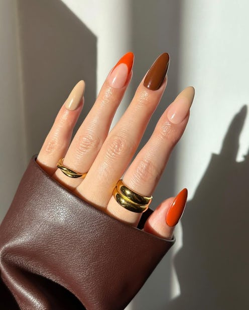 Need ideas for Thanksgiving nails in 2022? Here are festive, fall manicures to use for nail art insp...