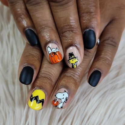 A Thanksgiving nail design inspired by "A Charlie Brown Thanksgiving."