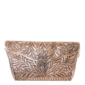 From St Xavier rose gold metal clutch