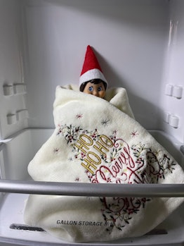 an elf hiding in the fridge in an article about if elf on the shelf is real