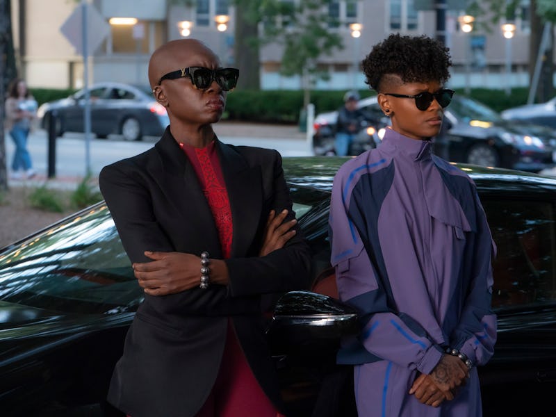 Okoye (Danai Gurira) and Shuri (Letitia Wright) lean against a car in Black Panther: Wakanda Forever