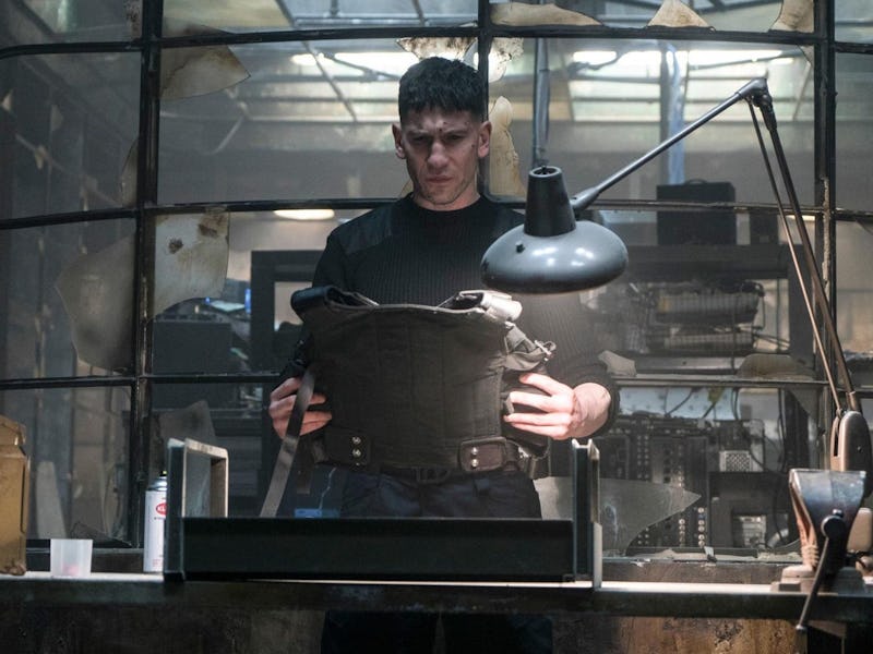 Frank Castle (Jon Bernthal) looks at a bulletproof vest in The Punisher Season 1