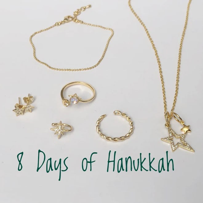 A set of eight pieces of dainty gold necklaces, rings, and earrings