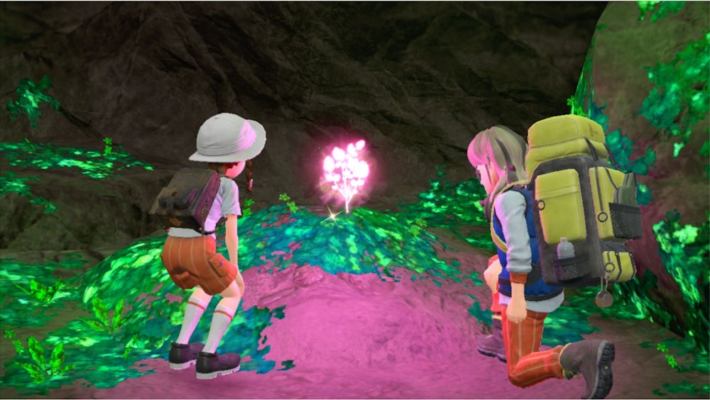Arven and player looking at glowing herb in cave