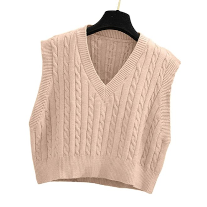 Soft and stretchy, this knit cropped vest can be worn alone or with a shirt underneath.