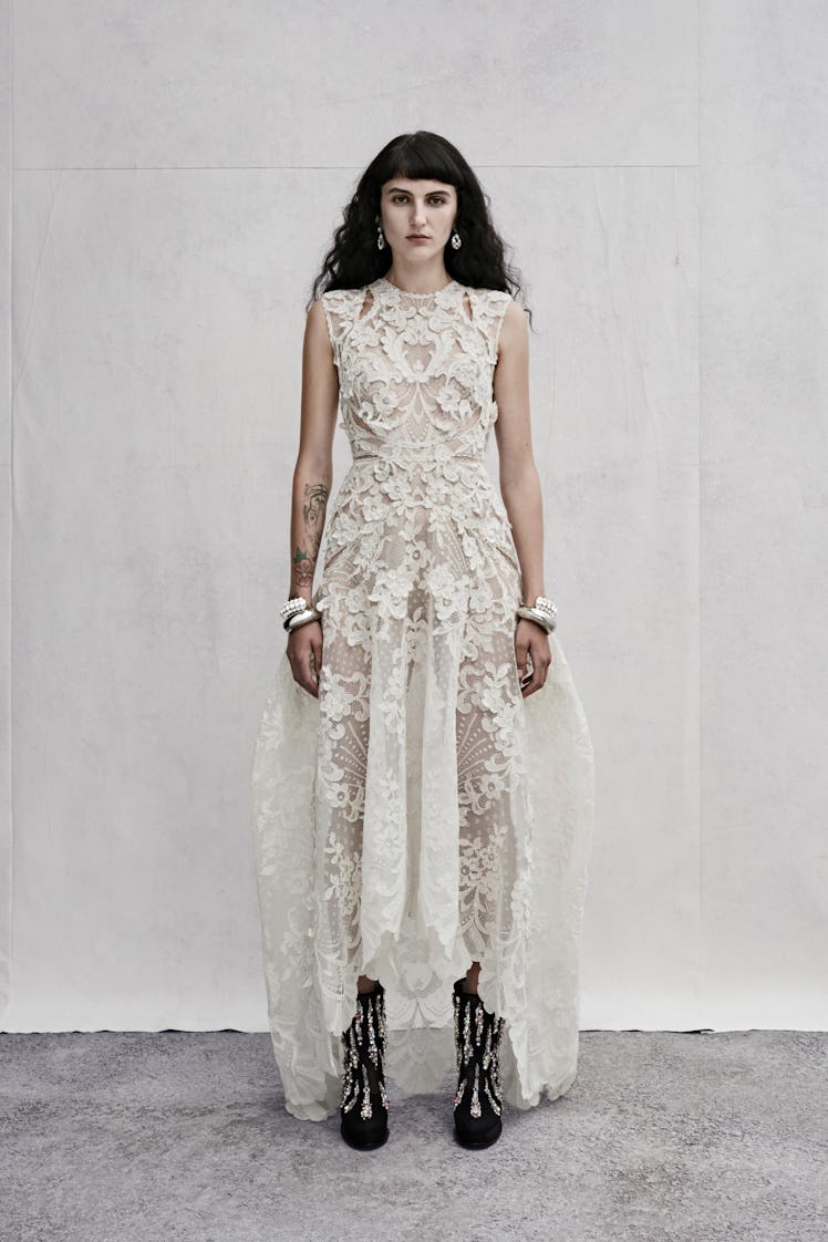 Alexander McQueen white lace dress worn by a female model