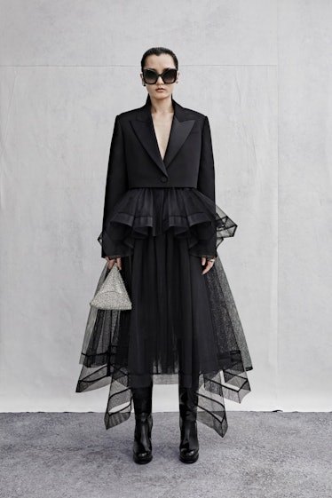 Alexander McQueen black tuxedo jacket and tulle skirt worn by a female model
