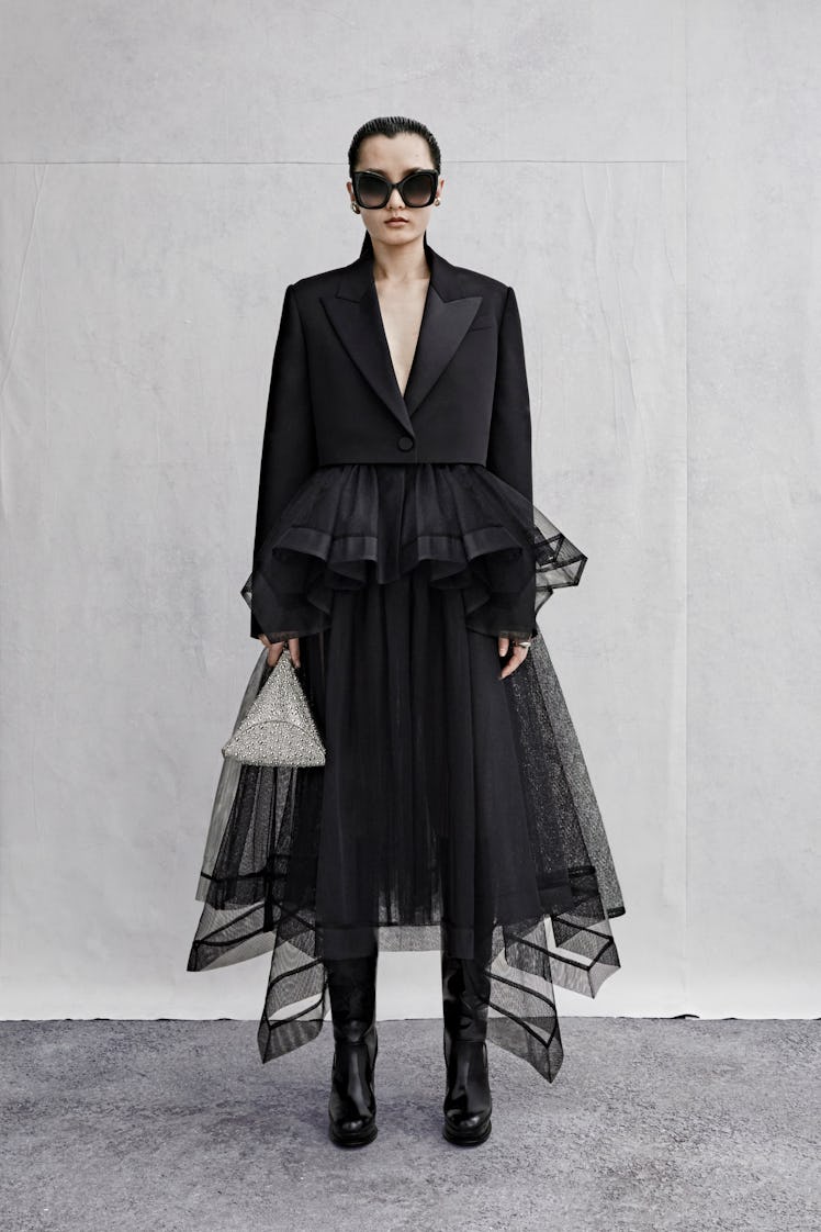Alexander McQueen black tuxedo jacket and tulle skirt worn by a female model