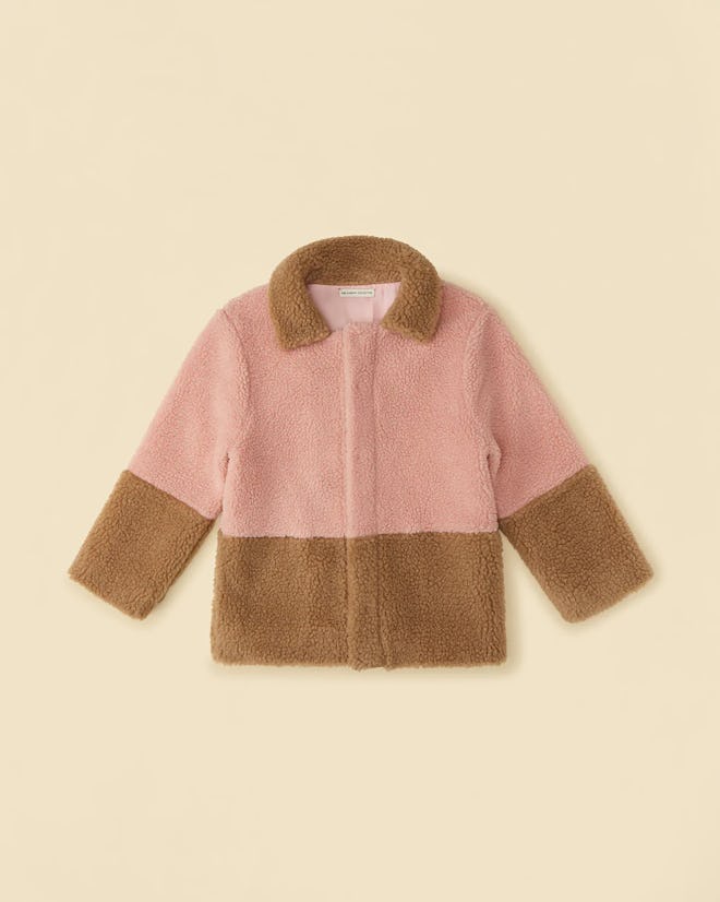 A shearling pink and brown coat is a practical non-toy gift idea for kids.