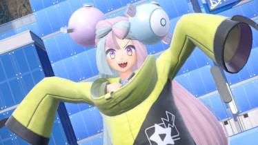 Iono in loose hoodie waving arms in air and smiling
