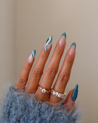 Sparkly blue swirl nails
