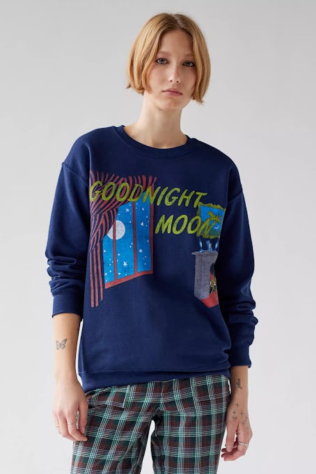 Dopamine dress for volunteering wearing the Goodnight Moon Pullover Sweatshirt from Urban Outfitters