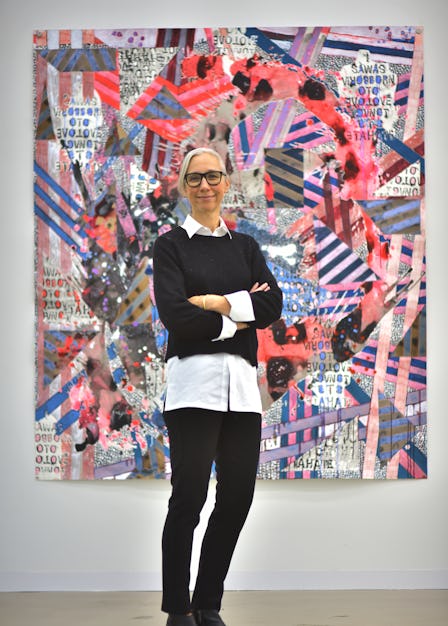 A portrait of Alexandra Grant in front of one of her works