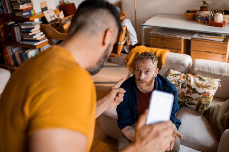 Male couple arguing in an apartment