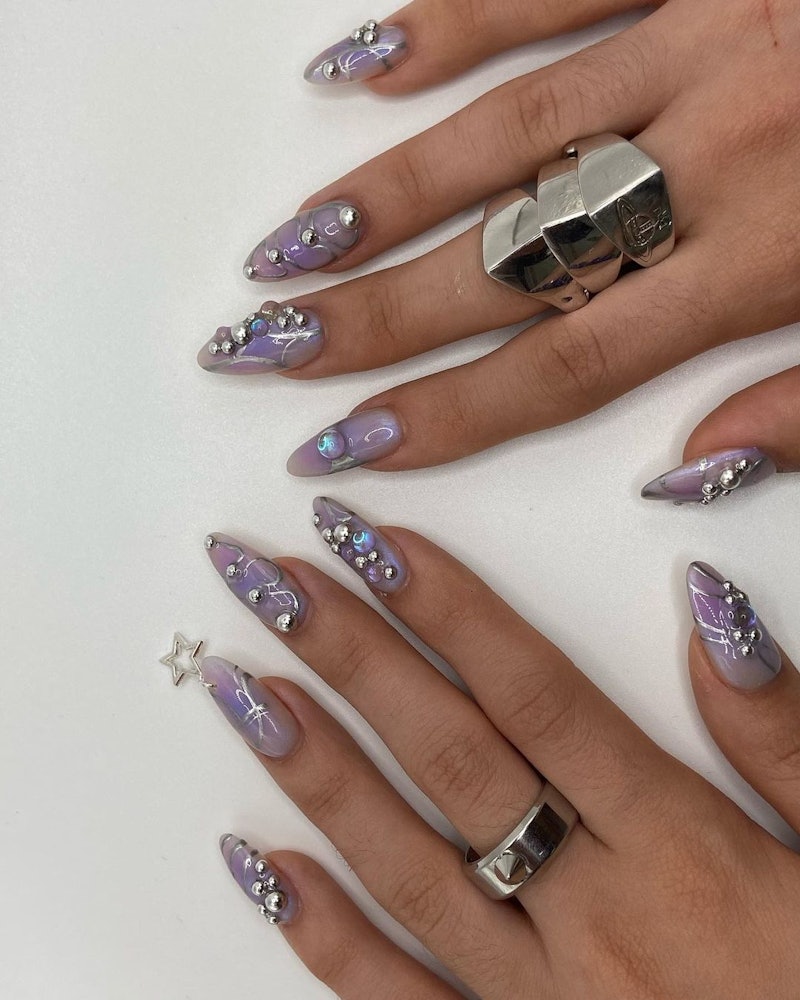 12 Logo Nail Ideas That Bring Luxury to Your Fingertips