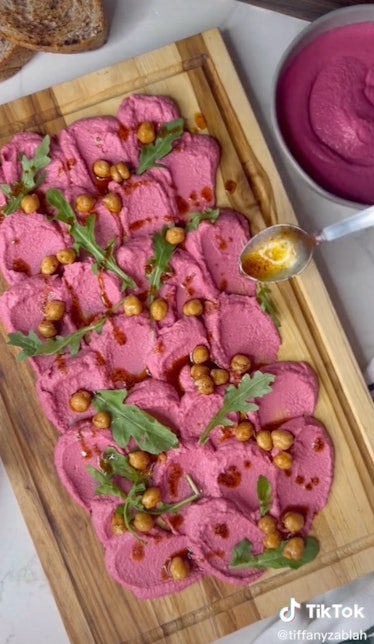 A beet hummus board is a fall hummus board idea from TikTok for game day or friendsgiving.