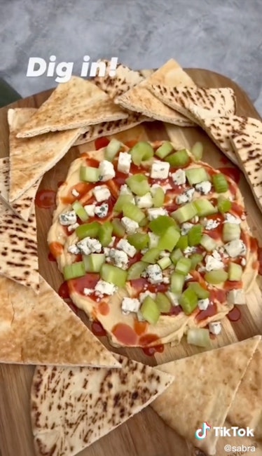 A buffalo wing hummus board is a fall hummus board idea from TikTok for game day or friendsgiving.