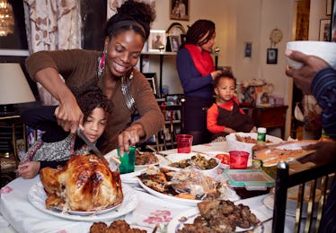 Happy family at the table with their food tradition