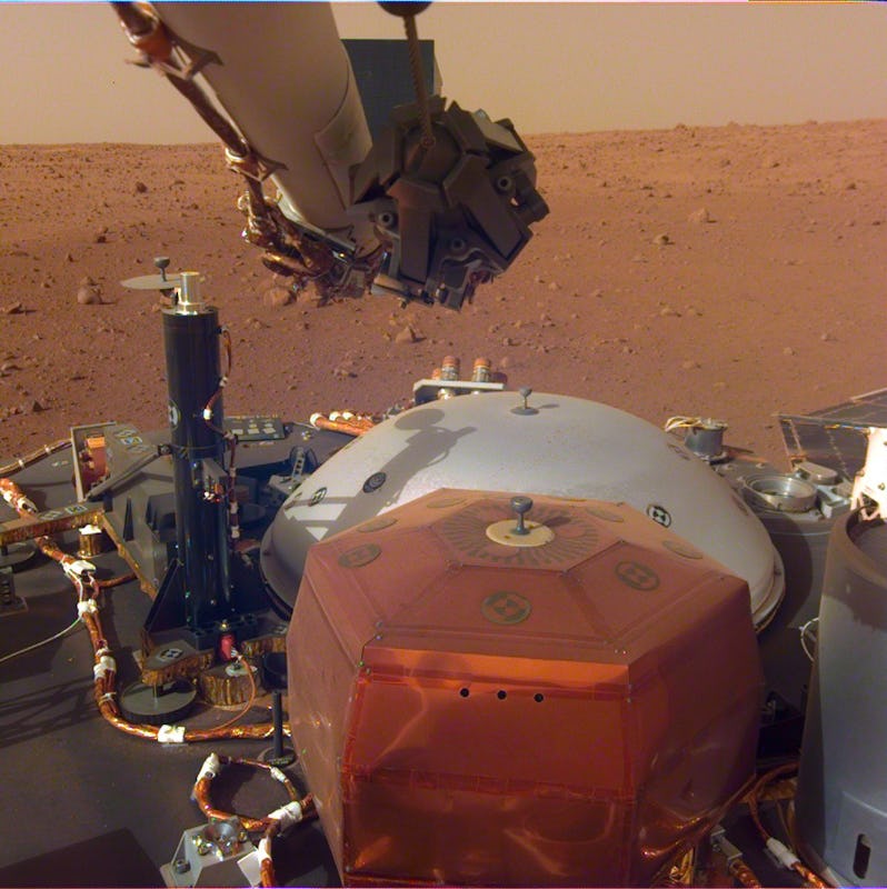 InSight's instruments are visible here with the Martian surface in the background