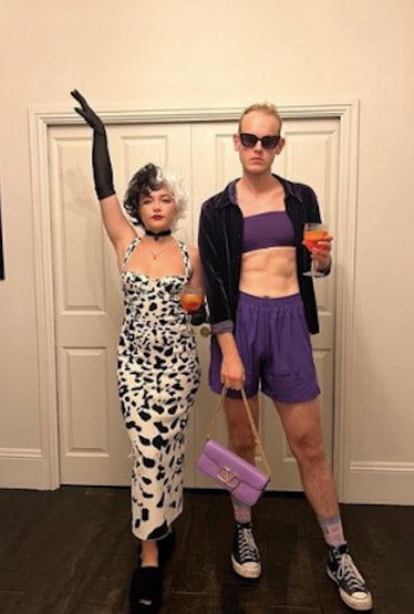 Florence Pugh dressed as Cruella Deville and her friend Theo Smith dressed as Florence wearing her p...