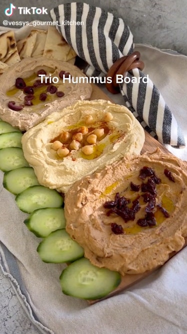 A trio hummus board is a fall hummus board idea  from TikTok for game day or friendsgiving.