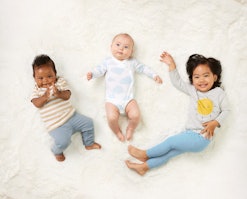 Three children model clothing from the new mighty goods line at buybuy BABY.