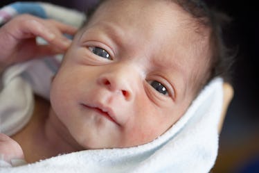 Close-up of a newborn's face.