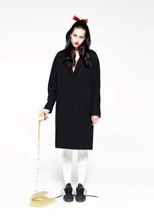 Amelia Gray wears a Herno coat; Wolford tights; Adidas sneakers.