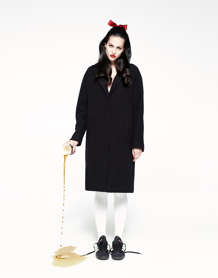 Amelia Gray wears a Herno coat; Wolford tights; Adidas sneakers.