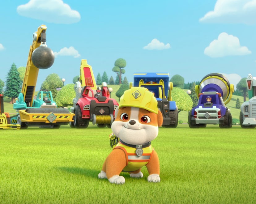 Rubble the bulldog stands in front of a fleet of construction vehicles in 'Rubble and Crew,' a 'PAW ...