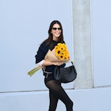 Kendall Jenner wearing black hotpants and black tights