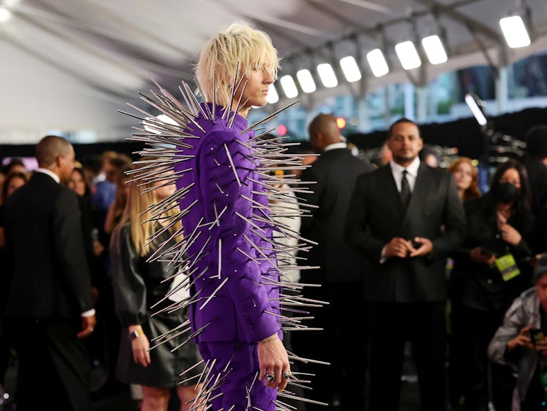 Machine Gun Kelly at the 2022 AMAs, wearing a spiked purple suit.