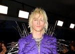Machine Gun Kelly at the 2022 AMAs, wearing a spiked purple suit.