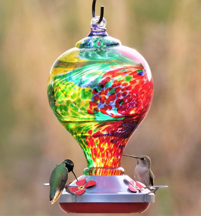This Hand Blown Glass Hummingbird Feeder in Nebula is one of the best gifts to give your mother-in-l...