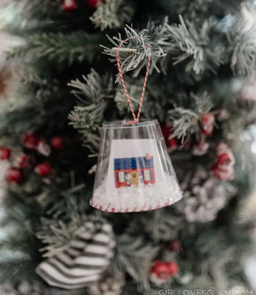 A DIY snow globe ornament made by your kids is a great gift idea for your mother-in-law.
