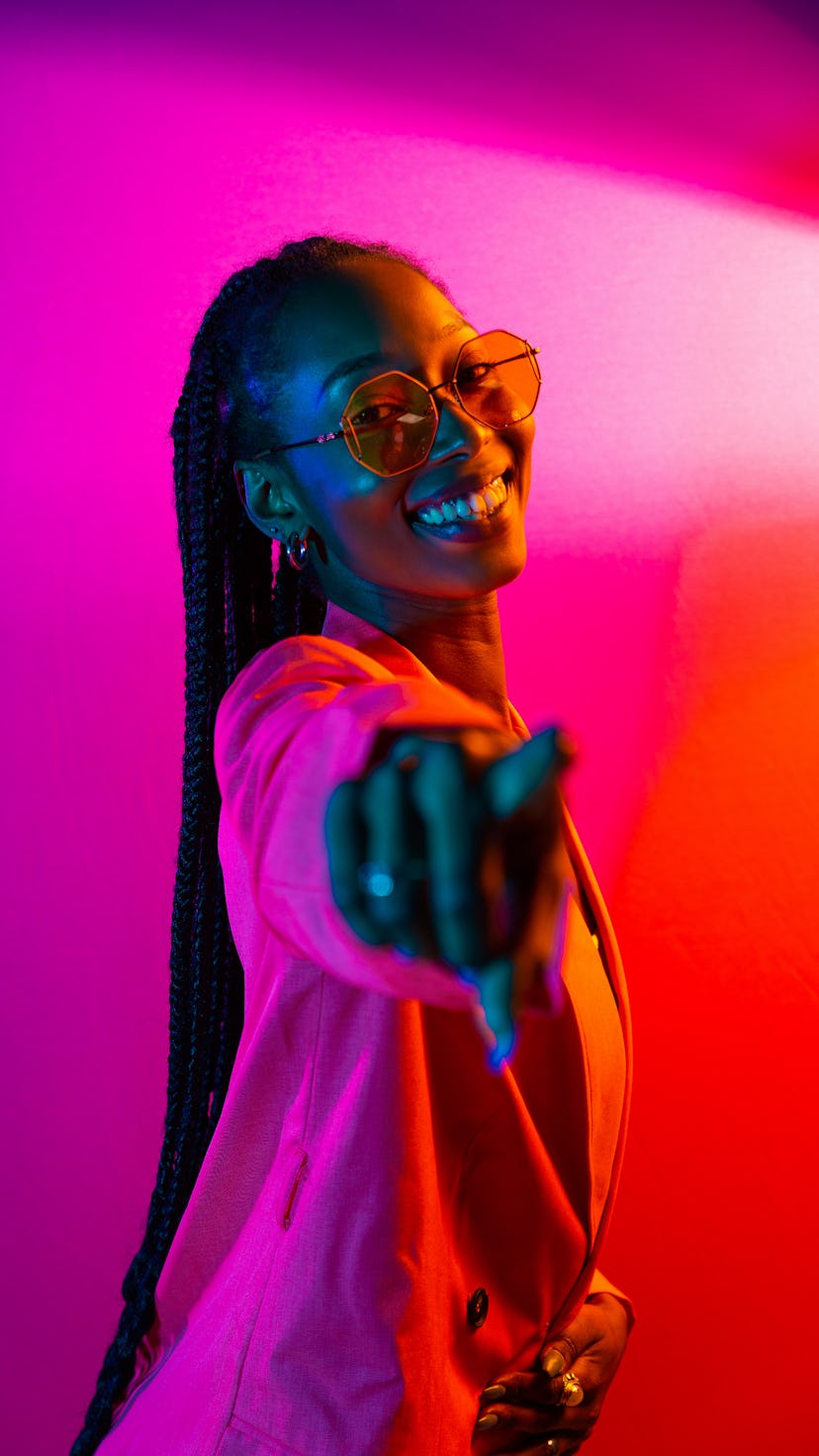 Happy young woman, pointing to the camera on the luckiest day in December 2022.