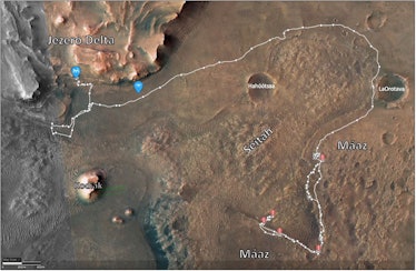 satellite view of rock formations on Mars, with a rover's path traced around them