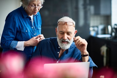 Older man and woman looking at computer