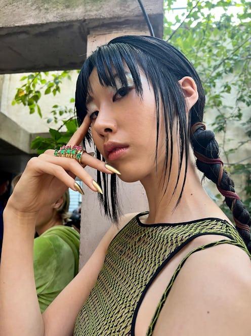 Priscavera model with long gold nails