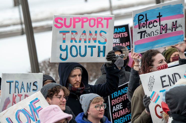 Minnesotans hold a rally at the capitol to support trans kids.